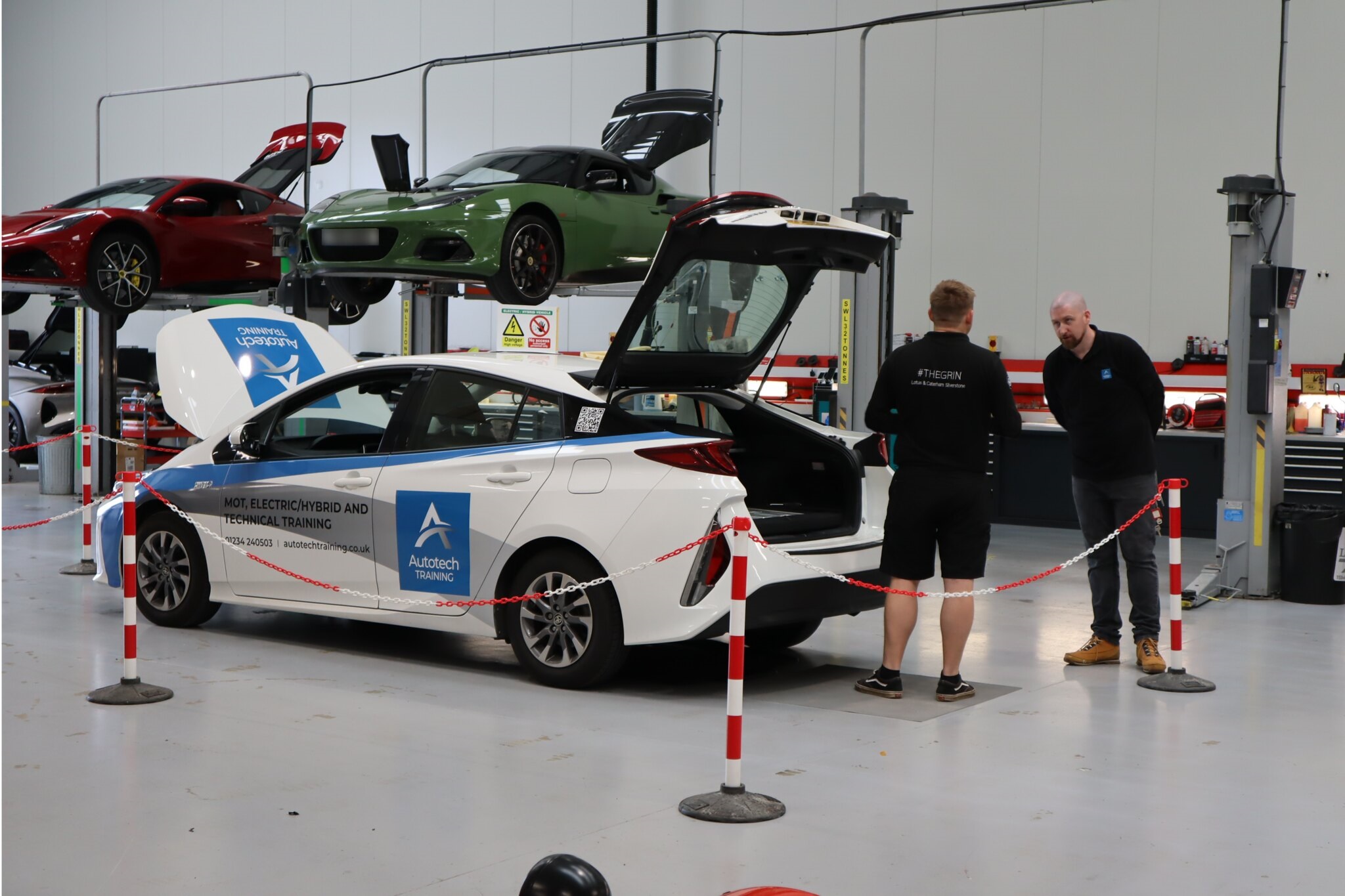 Technicians working on EVs